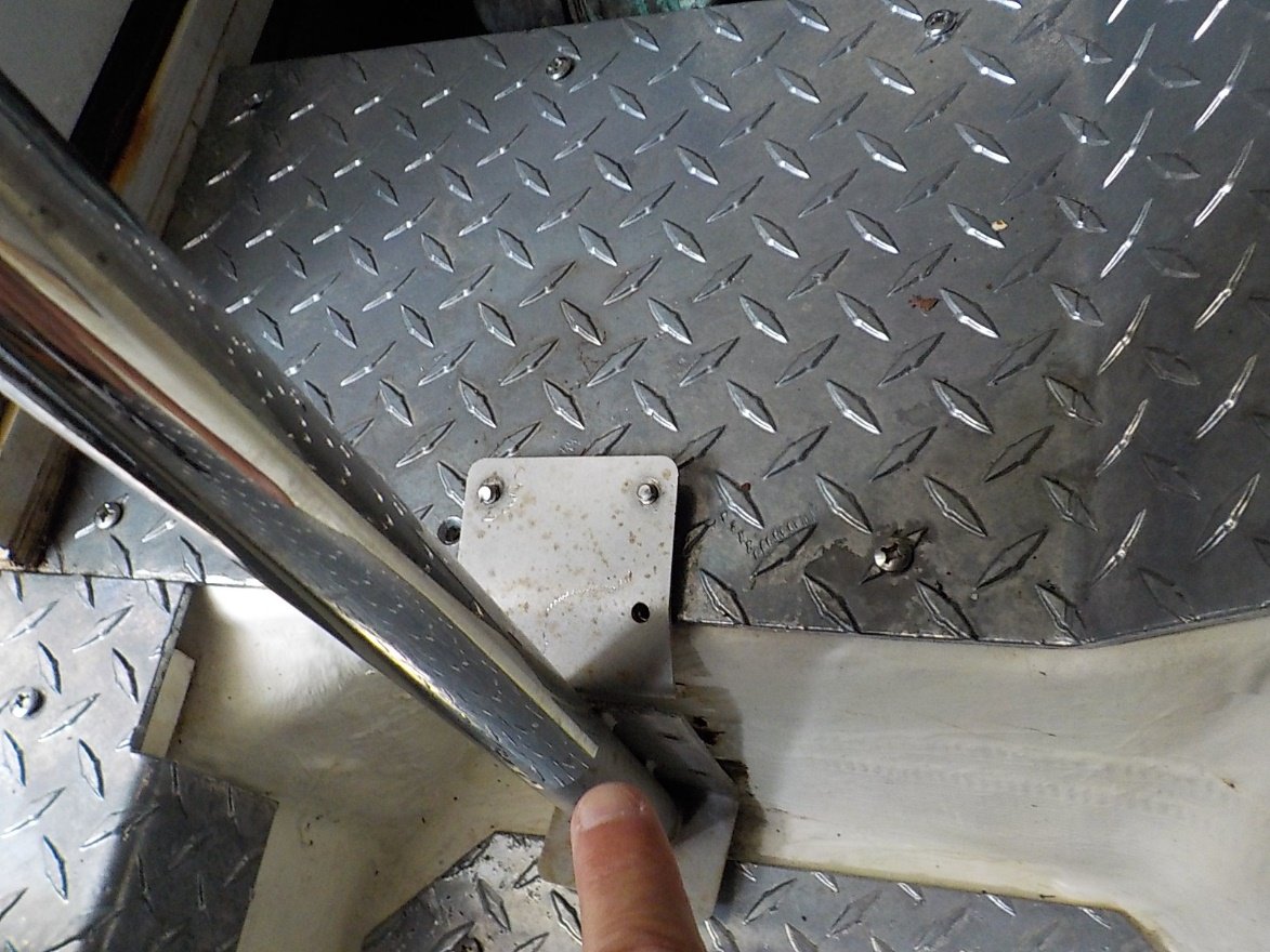 Surveyor pointing to detached support post below deck of boat