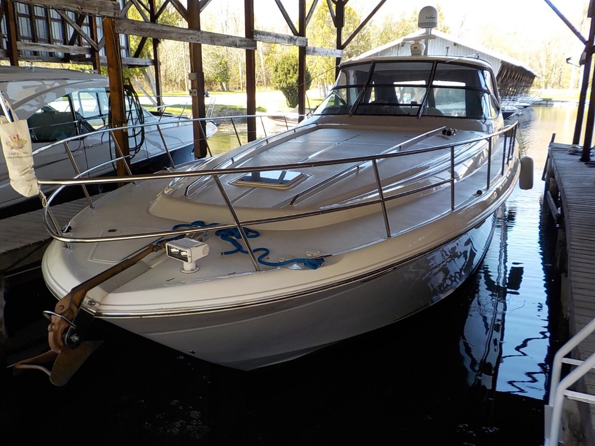 Boat in water inside boathouse