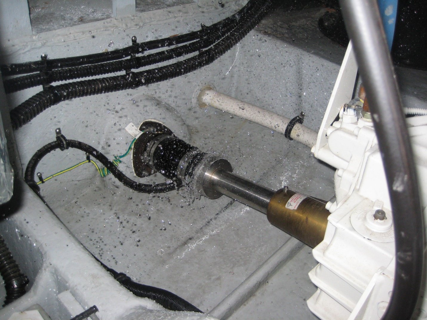 Water spraying from shaft seal of boat during sea trial